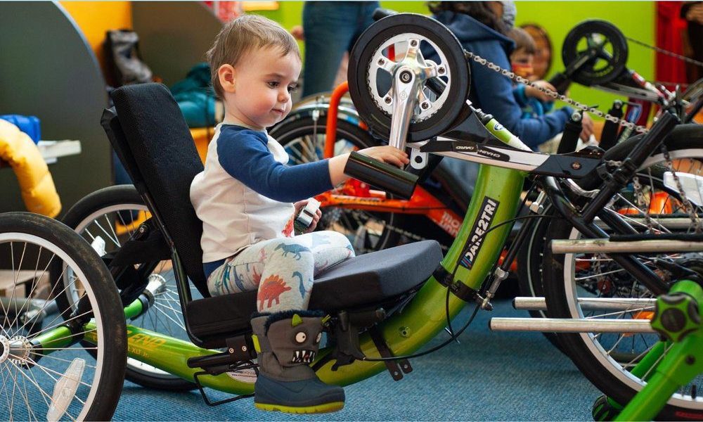 Boy Playing on Bicycle at Chicago Children's Museum at Navy Pier